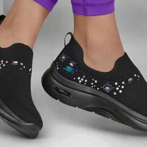 Skechers Women's Black Slip-On Sneakers - Ayla. Have multi colored rhinestones.